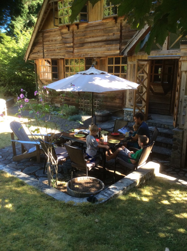 Family enjoying patio area in the shade.